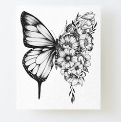 a drawing of a butterfly with flowers on it's wings is held up in front of the camera