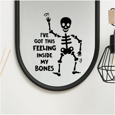 a skeleton is holding a sticker that says i've got this feeling inside my bones