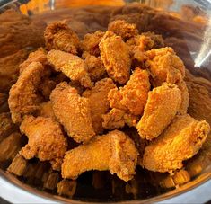 fried chicken is in a bowl on the table