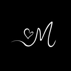 the letter m is written in white ink with a heart at the top and bottom