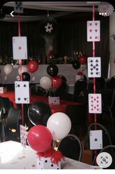 a casino themed party with balloons and cards