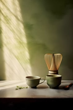 Cup of tea and whisk on rustic table in serene green dawn light. Organic Tea Brands, Coffee Jitters, Cake Background, Matcha Aesthetic, Ceremonial Grade Matcha, Butterfly Lighting, Organic Matcha, Premium Tea, Matcha Bowl