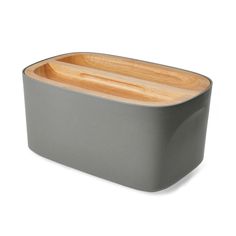 a gray container with wooden handles on a white background