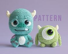 two crocheted monsters sitting next to each other on a purple background with the words pattern below them