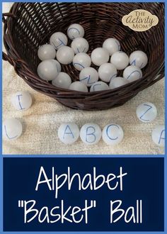 a basket filled with white plastic balls next to the words alphabet and numbers on it