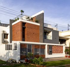 a modern house with brick and concrete exterior