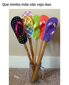 six pairs of colorful flip flops in a cup