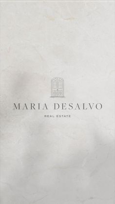 the front cover of a real estate in marbella desalvo, with white marble