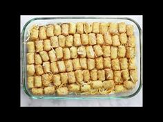 a glass casserole dish filled with tater tots