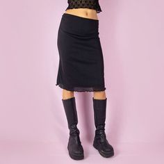 The Y2K Mesh Black Midi Skirt is a vintage 2000s stretchy skirt featuring an elastic waist and semi-sheer mesh fabric. Combining a casual and whimsical design, it's perfect for any party or night-out outfit. TAG SIZE L - EUR 40/42 MEASUREMENTS Length 58cm - 22.83 inch Waist 80cm - 31.49 inch Hips 96cm - 37.79 inch Our model is 172 cm tall and usually wears size XS. Please be aware that some items may be slightly pinned on the model to demonstrate the correct fit. We ship worldwide from Spain and Black Mesh Skirt, Sheer Midi Skirt, Stretchy Skirt, Skirt Y2k, Vintage Rock, Night Out Outfit, Mesh Skirt, Black Midi Skirt, Black Midi