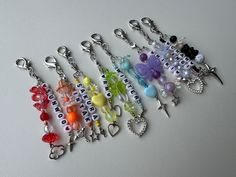 a row of key chains with charms on them