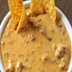 a white bowl filled with salsa and tortilla chips