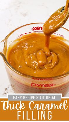 the sauce is being poured in a glass measuring cup to make thick caramel filling