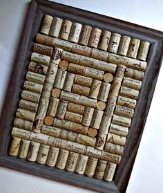 a framed cork board with wine corks on it