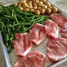 meat, green beans and potatoes on a tray