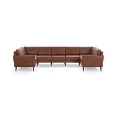 a brown leather sectional sofa with black legs and arm rests on an isolated white background