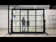 a man standing in front of a glass door