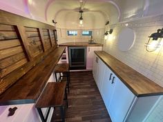 the kitchen is clean and ready to be used as a dining area in this tiny home