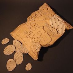 some wood slices are laying next to each other on a black surface with words carved into them