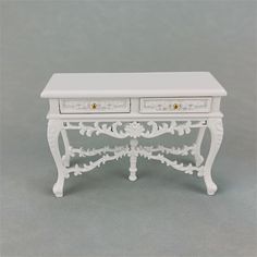 a white table with two drawers on it