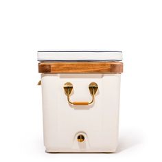 a white cooler with a wooden lid and handle on the side, sitting against a white background