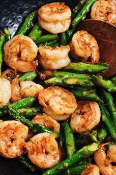 shrimp and asparagus stir fry in a wok