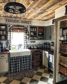 a kitchen with checkered flooring and wooden ceiling