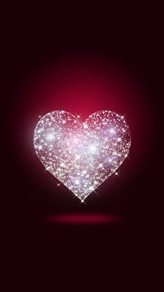 a heart made out of sparkles on a dark background