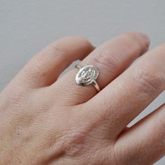 A small version of our Virgin Mary Ring has a half round band. Super comfortable and made in high quality, yet affordable metal, for all day everyday wear. Choose from all Gold Filled or Sterling Silver +Shown with our Baguette Arc Ring, sold separately Mary is 9mm x 13mm, band is 2mm wide Made to order in any size! Chose your size at checkout. Gold Filled has 100 times more gold than gold plated jewelry. You can swim, shower, etc, this ring is made to wear exactly like solid 14K Gold and will n Oval Silver Halo Ring In 14k Gold, 14k Gold Silver Halo Ring, Virgin Mary Ring, Layered Rings, All Day Everyday, Dope Jewelry, Christmas 2020, Metal Ring, Gold Collection