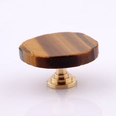 an image of a wooden knob on a white background