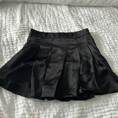 Shorts Built Into Skirt. Tags Attached Never Worn. 100% Polyester. Size Small. Casual Black Shorts With Lined Skirt, Short Solid Skirt For Night Out, High Waist Casual Tennis Skirt For Night Out, Casual High Waist Tennis Skirt For Night Out, Black Tennis Skirt With Short Inseam And Lining, Short Pleated Bottoms For Night Out, Black Mini Skirt For Night Out With Short Inseam, Casual Black Short Pleated Skirt, Black Casual Short Pleated Skirt