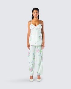 From getting your beauty rest to running around the town - this two-piece set will have you on your prettiest behavior 🤍 Pairing a cami top with matching wide leg pants, you'll stun in the perfect floral look 🤩 Green Sleepwear Sets For Spring, Summer Pajama Party Sets With Spaghetti Straps, Spring Loungewear Sets, Summer Cami Set For Pajama Party, Summer Camisole Set For Daywear, Spring Vacation Two-piece Pant Set, Spring Casual Camisole Set, Green Floral Print Pant Set For Spring, Spring Chic Loungewear Pant Set