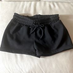 Black Sweatshorts Never Worn Casual Black Stretch Athletic Shorts, Black Fitted Casual Athletic Shorts, Casual Black Fitted Athletic Shorts, Casual Black Shorts With Drawstring, Casual Black Drawstring Shorts, Casual Black Athletic Shorts For Summer, Chic Black Shorts With Elastic Waistband, Black Stretch Athletic Shorts For Spring, Black Casual Shorts