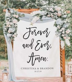 a sign that says forever and ever are on the front of a wedding ceremony arch