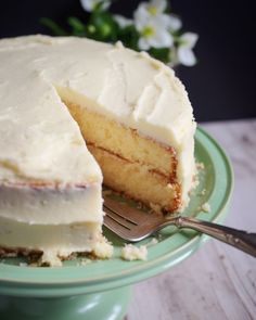 a close up of a cake on a plate with a slice taken out of it