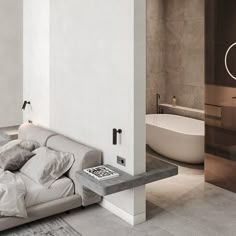 a white couch sitting next to a bath tub in a bathroom