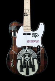 an electric guitar with some decorations on it