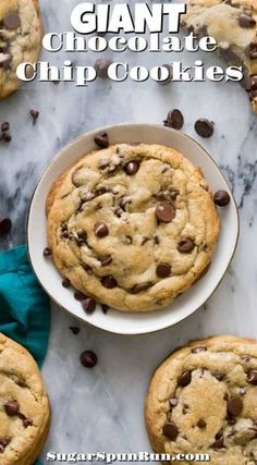 giant chocolate chip cookies on a white plate