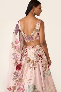 The pink lehenga is created with multicolor threadwork embroidery is embellished with sequin, cutdana, beads and stones. It is paired with classic blouse and dupatta with thread and bead work. Luxury Anarkali Blouse Piece In Pink, Luxury Summer Lehenga With Resham Embroidery, Luxury Floral Embroidered Lehenga For Festive Occasions, Luxury Spring Georgette Lehenga, Affordable Pink Embroidered Traditional Wear, Luxury Pink Blouse With Unique Design, Luxury Floral Embellished Choli For Party, Luxury Pink Traditional Wear With Printed Motifs, Luxury Pink Blouse With Intricate Embroidery