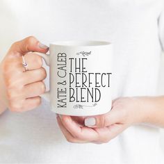 a woman is holding a coffee mug with the words, make & give on it