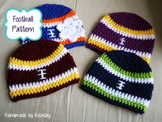 three crocheted beanies are laying on a bed with the word football written across them