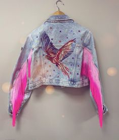 This stunning jacket is a totally one of a kind, unique piece. If you are going to a festival this summer, you will not see anyone else wearing a jacket like this !  Crafted using a pre-loved jacket, preventing waste and potential land fill, customised and embellished by me, in my little design studio in Wales. Decorated with iron on patches, sequins, gems, and fabulous neon arm tassels, this jacket with really make you stand out in a crowd.  jacket is UK size 12-14. slightly cropped, casual fit Bespoke Denim, Wrestling Clothes, Swift Party, Upcycled Jackets, Embroidery Jacket, Painted Clothing, Custom Denim Jacket, Festival Jacket, Denim Art