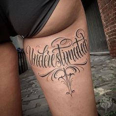 a woman with a tattoo on her leg that reads, understirings and