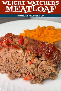 meatloaf on a plate with carrots and mashed potatoes in the background