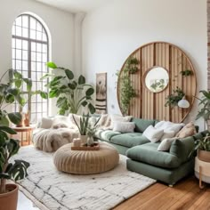 a living room filled with lots of plants and furniture