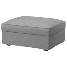 a large gray ottoman with black legs