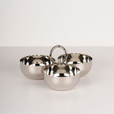 three stainless steel bowls sitting on top of each other