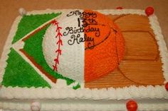 a birthday cake decorated with an orange and green baseball