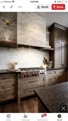 a kitchen with wooden cabinets and marble counter tops