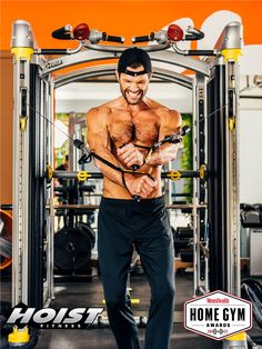 a man with no shirt on in front of a gym machine and holding a rope